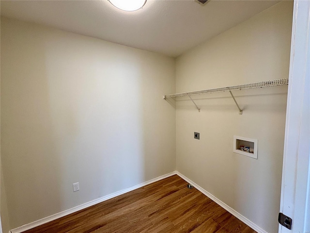 813 Breeze Ct, Perryville, MO 63775 - washroom with electric dryer hookup, hookup for a washing machine, dark wood-style floors, and baseboards