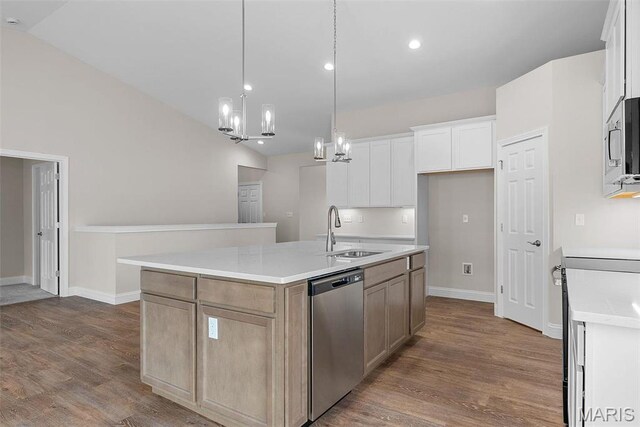2995 Halls Green Dr, Washington, MO 63090 - kitchen featuring appliances with stainless steel finishes, a sink, a chandelier, an island with sink, and dark wood finished floors