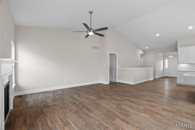2995 Halls Green Dr, Washington, MO 63090 - unfurnished living room with a ceiling fan, a fireplace, wood finished floors, baseboards, and high vaulted ceiling