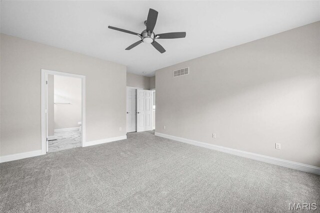 2995 Halls Green Dr, Washington, MO 63090 - unfurnished bedroom featuring carpet floors, baseboards, connected bathroom, and a ceiling fan