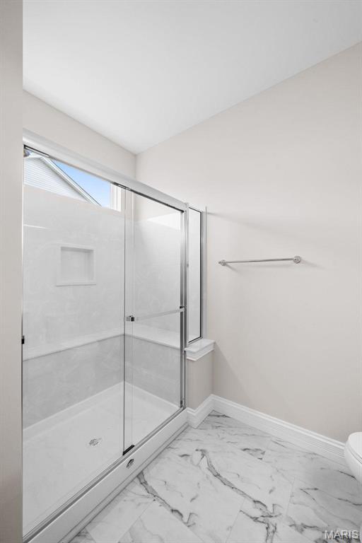 2995 Halls Green Dr, Washington, MO 63090 - full bath with marble finish floors, toilet, baseboards, and a stall shower