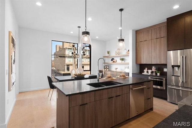 215 N Sarah St Unit 13, Saint Louis, MO 63108 - kitchen with stainless steel appliances, a sink, modern cabinets, light wood-type flooring, and recessed lighting