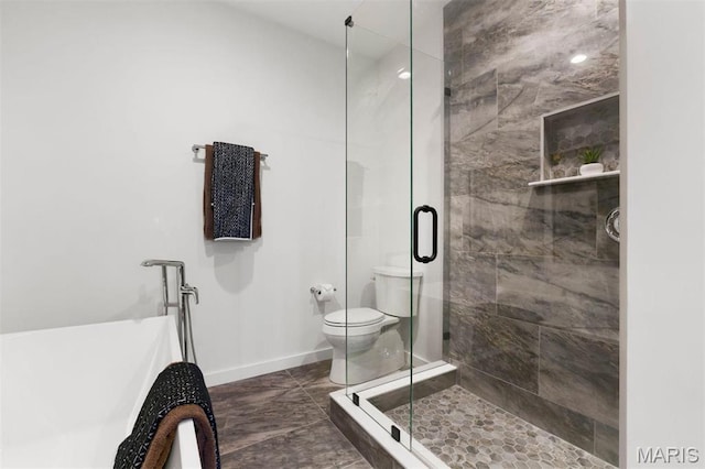 215 N Sarah St Unit 13, Saint Louis, MO 63108 - bathroom with a shower stall, a soaking tub, baseboards, and toilet