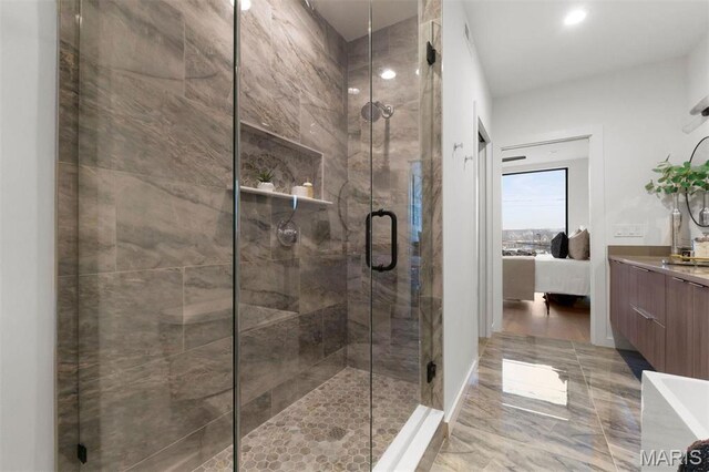 215 N Sarah St Unit 13, Saint Louis, MO 63108 - ensuite bathroom with a shower stall, vanity, and marble finish flooring