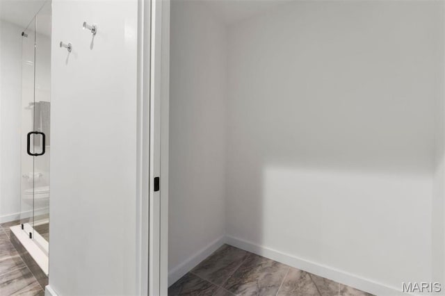 215 N Sarah St Unit 13, Saint Louis, MO 63108 - bathroom featuring baseboards and a shower stall
