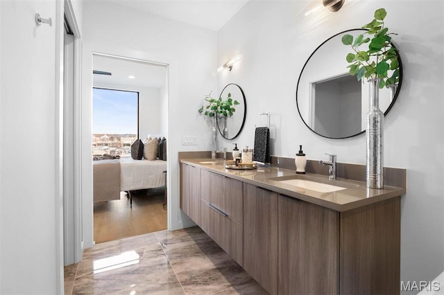 215 N Sarah St Unit 13, Saint Louis, MO 63108 - bathroom featuring double vanity and marble finish floors