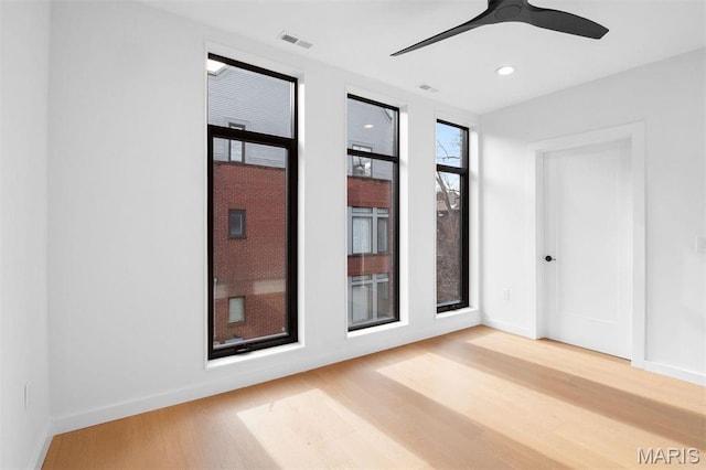 215 N Sarah St Unit 13, Saint Louis, MO 63108 - spare room featuring wood finished floors, a ceiling fan, baseboards, and recessed lighting