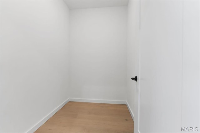 215 N Sarah St Unit 13, Saint Louis, MO 63108 - unfurnished room featuring baseboards and light wood-style flooring