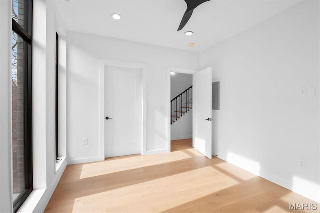 215 N Sarah St Unit 13, Saint Louis, MO 63108 - spare room with wood finished floors, recessed lighting, a ceiling fan, and baseboards