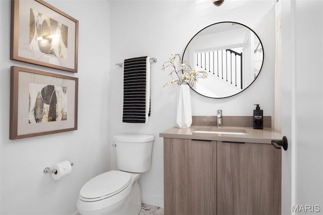 215 N Sarah St Unit 13, Saint Louis, MO 63108 - half bath with baseboards, toilet, and vanity