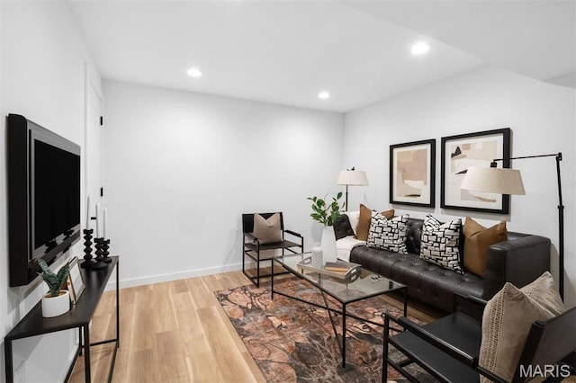 215 N Sarah St Unit 13, Saint Louis, MO 63108 - living room with light wood-style flooring, recessed lighting, and baseboards