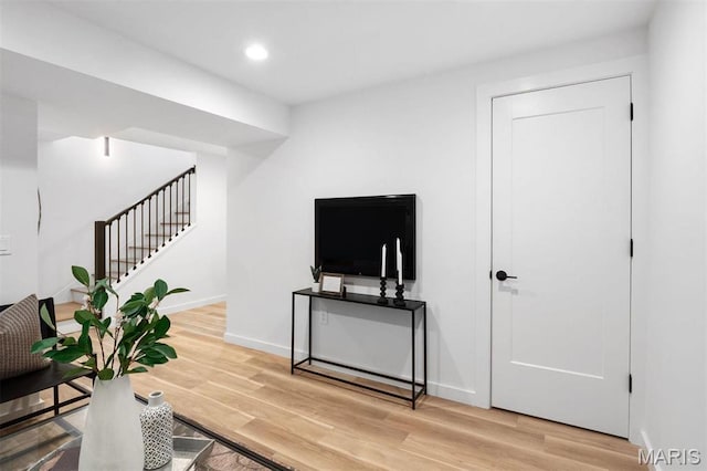 215 N Sarah St Unit 13, Saint Louis, MO 63108 - living room featuring stairs, light wood-style floors, recessed lighting, and baseboards