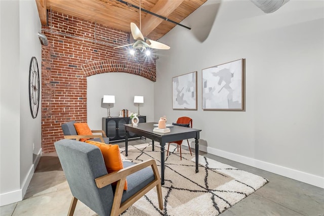 office area with concrete flooring, baseboards, brick wall, a high ceiling, and wood ceiling