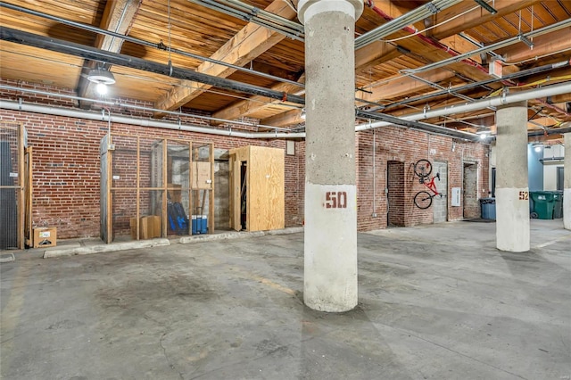 unfinished below grade area with brick wall