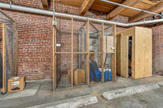 misc room with brick wall