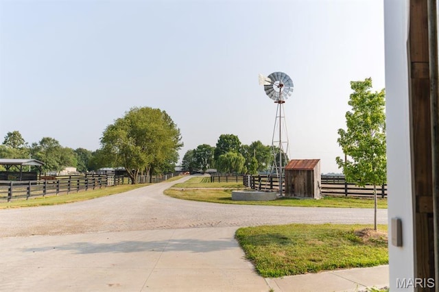 13112 Heritage Ln, Pocahontas, IL 62275 - view of property's community with an exterior structure, driveway, and an outbuilding
