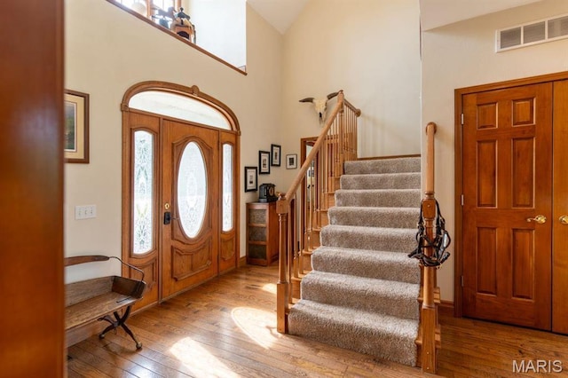 13112 Heritage Ln, Pocahontas, IL 62275 - entryway featuring wood-type flooring, stairway, high vaulted ceiling, and baseboards