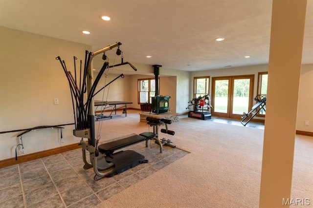 13112 Heritage Ln, Pocahontas, IL 62275 - workout room featuring a wood stove, recessed lighting, carpet floors, and baseboards