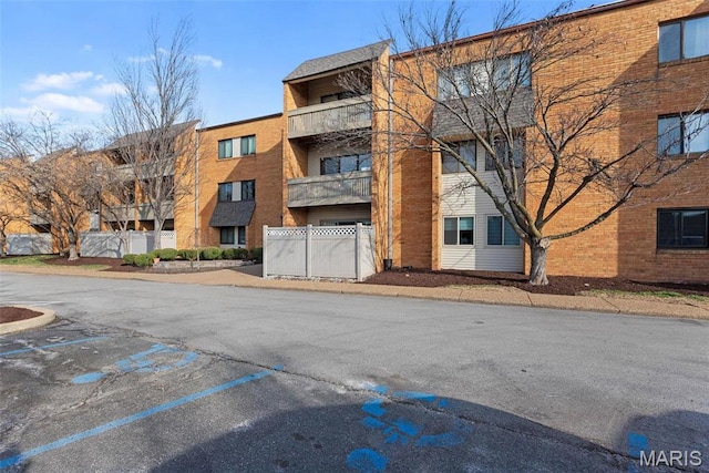 950 E Rue De La Banque Unit 110, Creve Coeur, MO 63141 - view of apartment building / complex with uncovered parking