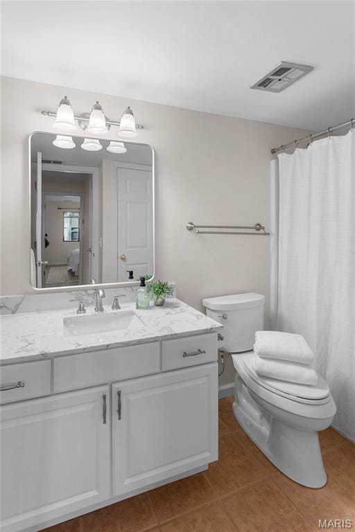 950 E Rue De La Banque Unit 110, Creve Coeur, MO 63141 - bathroom with toilet, tile patterned floors, and vanity