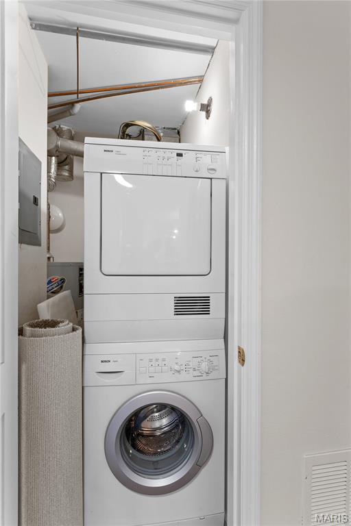 950 E Rue De La Banque Unit 110, Creve Coeur, MO 63141 - washroom featuring stacked washer / dryer and electric panel