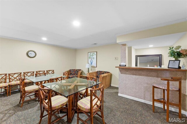 950 E Rue De La Banque Unit 110, Creve Coeur, MO 63141 - dining area featuring carpet floors, crown molding, recessed lighting, and baseboards
