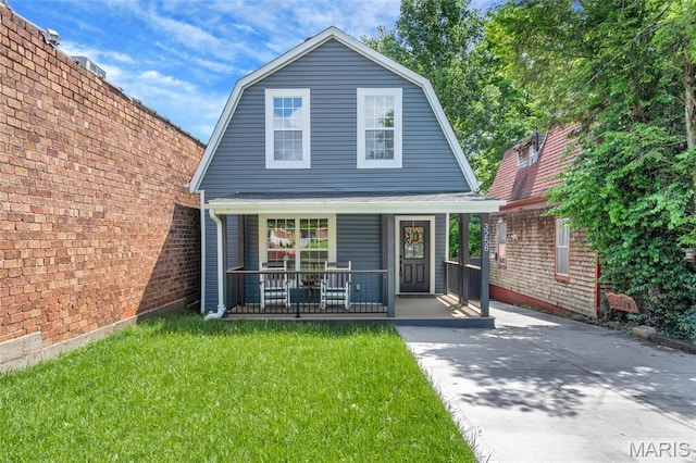 3258 Walter Ave, Saint Louis, MO 63143 - dutch colonial featuring a gambrel roof, covered porch, and a front lawn