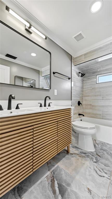 3258 Walter Ave, Saint Louis, MO 63143 - full bath with marble tiled flooring, ornamental molding, shower / tub combination, toilet, and vanity