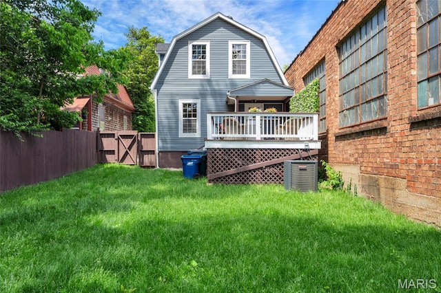 3258 Walter Ave, Saint Louis, MO 63143 - back of house featuring a gambrel roof, a deck, a gate, and cooling unit