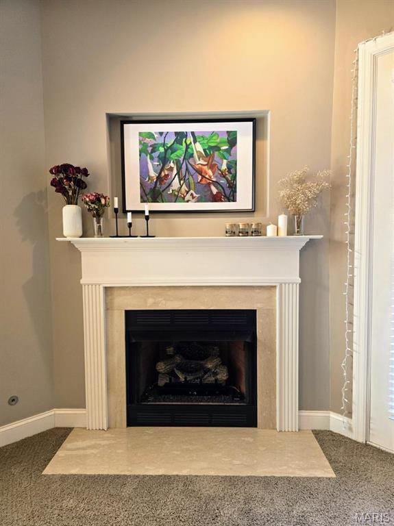 6416 Cates Ave, Saint Louis, MO 63130 - detailed view of a premium fireplace, carpet flooring, and baseboards