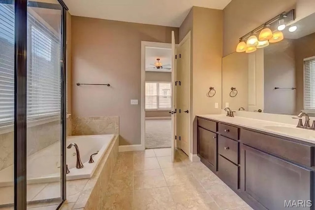 6416 Cates Ave, Saint Louis, MO 63130 - full bathroom with ceiling fan, a bath, double vanity, baseboards, and tile patterned floors