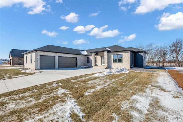600 Legacy Dr, Waterloo, IL 62298 - view of front of home with a garage, driveway, and brick siding