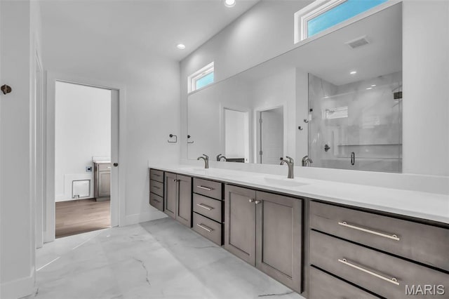 600 Legacy Dr, Waterloo, IL 62298 - bathroom with double vanity, a shower stall, recessed lighting, marble finish floors, and baseboards
