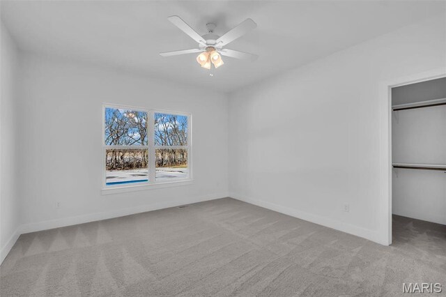600 Legacy Dr, Waterloo, IL 62298 - unfurnished bedroom featuring carpet, baseboards, a ceiling fan, and a closet
