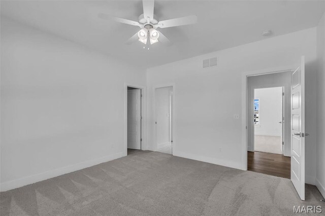 600 Legacy Dr, Waterloo, IL 62298 - carpeted spare room with a ceiling fan and baseboards