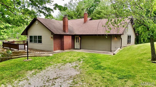 520 Christopher Dr, Perryville, MO 63775 - ranch-style home featuring a chimney, a front yard, an attached garage, a deck, and driveway