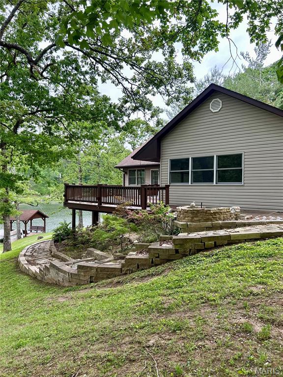 520 Christopher Dr, Perryville, MO 63775 - back of house with a deck and a yard