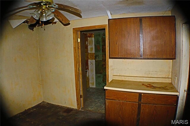 2202 Holland St, Alton, IL 62002 - kitchen featuring a ceiling fan, light countertops, and brown cabinets