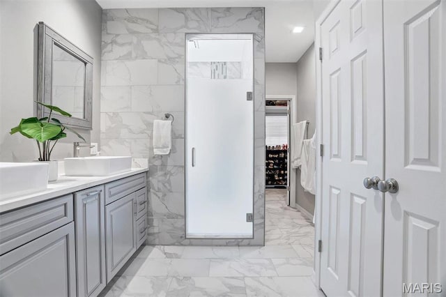 997 Sheffield Forest Ct, Wildwood, MO 63021 - bathroom featuring marble finish floors, vanity, and a shower