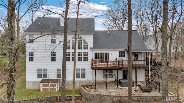 997 Sheffield Forest Ct, Wildwood, MO 63021 - back of house with a deck, a patio, roof with shingles, and stairway