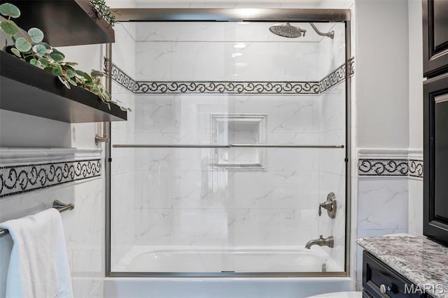 997 Sheffield Forest Ct, Wildwood, MO 63021 - bathroom featuring shower / washtub combination, tile walls, and vanity