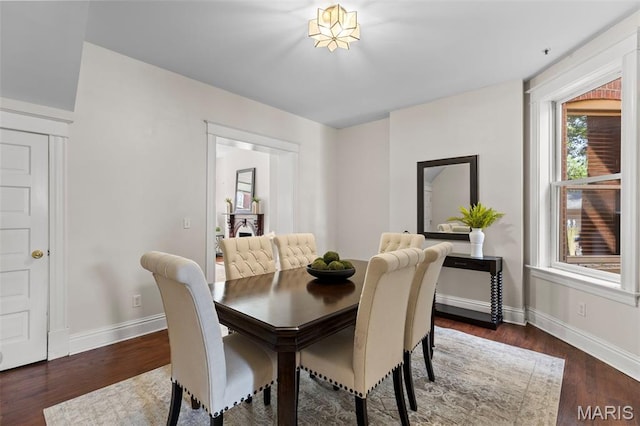 2811 Shenandoah Ave, Saint Louis, MO 63104 - dining room featuring baseboards and wood finished floors