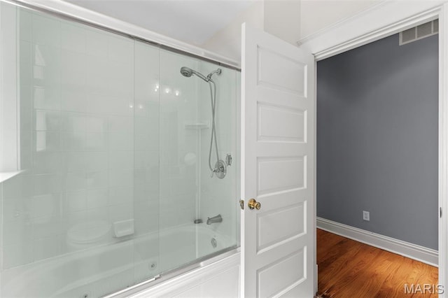 2811 Shenandoah Ave, Saint Louis, MO 63104 - full bathroom featuring a combined bath / shower with jetted tub and wood finished floors