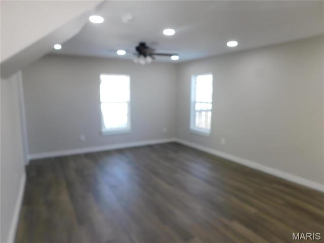 bonus room with baseboards, dark wood-type flooring, and recessed lighting