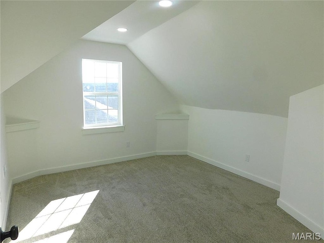 additional living space featuring lofted ceiling, carpet floors, baseboards, and recessed lighting