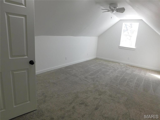bonus room featuring lofted ceiling, ceiling fan, carpet, and baseboards