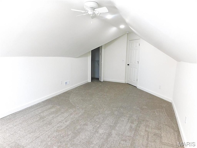 bonus room with carpet floors, vaulted ceiling, baseboards, and ceiling fan