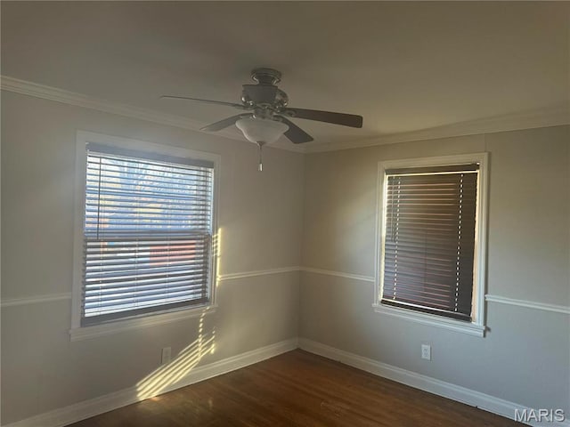 9100 Gedde Ave, Saint Louis, MO 63134 - spare room with dark wood finished floors, baseboards, ceiling fan, and crown molding
