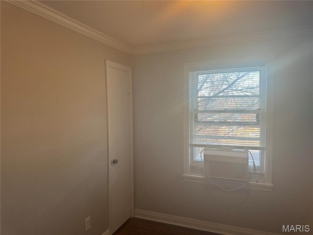 9100 Gedde Ave, Saint Louis, MO 63134 - spare room featuring crown molding, baseboards, and dark wood-style floors
