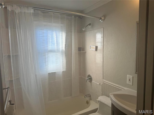 9100 Gedde Ave, Saint Louis, MO 63134 - bathroom featuring toilet, a textured wall, shower / tub combo, vanity, and a wainscoted wall
